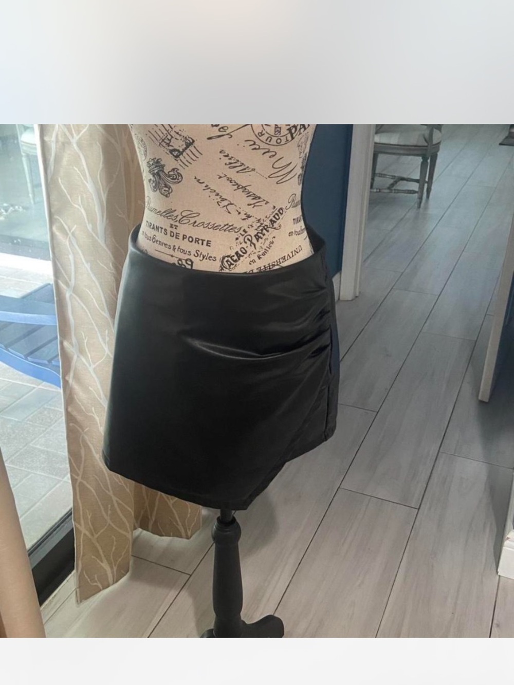 Luvamia .Sleek Black Faux Leather Mini Skirt